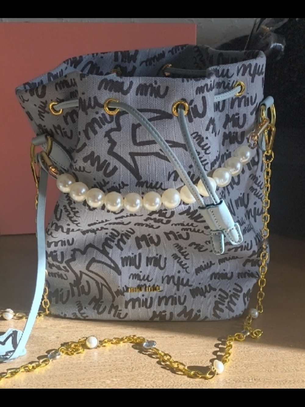 Miu Miu Gray Logo Drawstring Mini Bag with Light Blue Accents and Pearl Handle - Picture 3 of 4